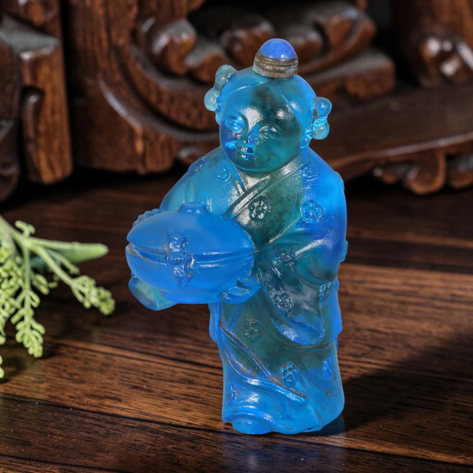 Vintage Chinese Liuli Glass Snuff Bottle - Carved Girl With Covered Bowl Figurine Vessel, 29AS: This fully sculpted anthropomorphic snuff bottle is crafted from translucent deep sky-blue frosted vintage Chinese liuli glass, shaped as a traditional young girl figure with twin side hair buns and f