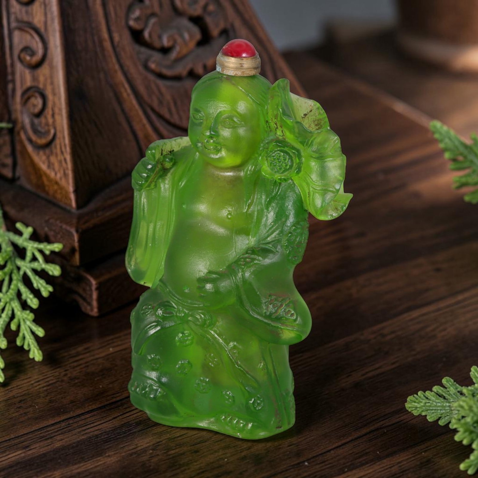 Vintage Chinese Liuli Glass Snuff Bottle - Carved He He Er Immortal With Lotus Figurine Vessel, 47AS: This fully sculpted anthropomorphic snuff bottle is molded from translucent frosted emerald vintage Chinese liuli glass, shaped as a traditional He He Er immortal figure with a soft gentle smile, flow