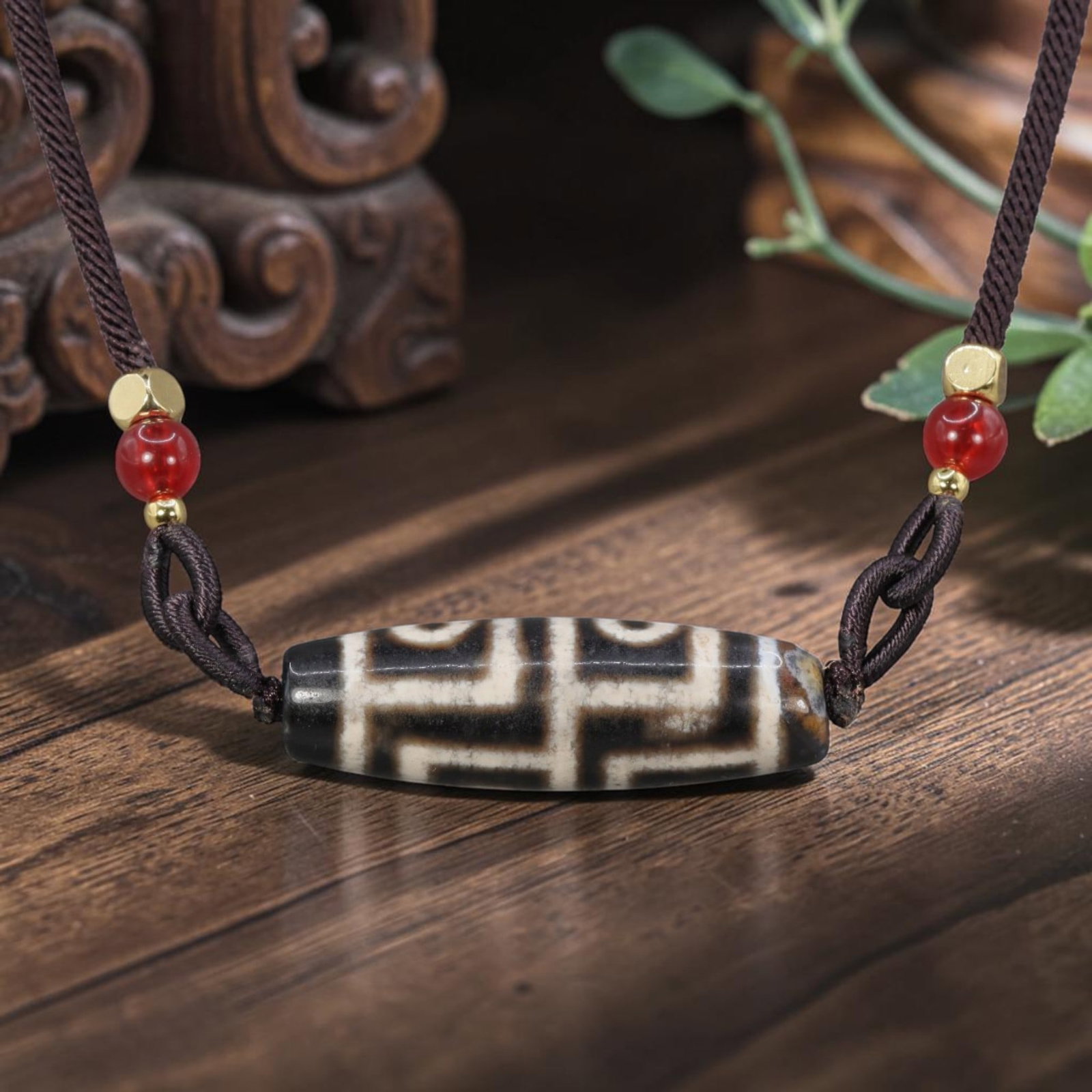 A Chinese Agate Four Eye Dzi Bead - Tibetan Pendant Necklace, 9YJ: Crafted from polished natural agate with etched white mineral inlay forming symmetrical four-eye symbolic motifs across the cylindrical bead form. The four eye totem is a revered traditional design wi