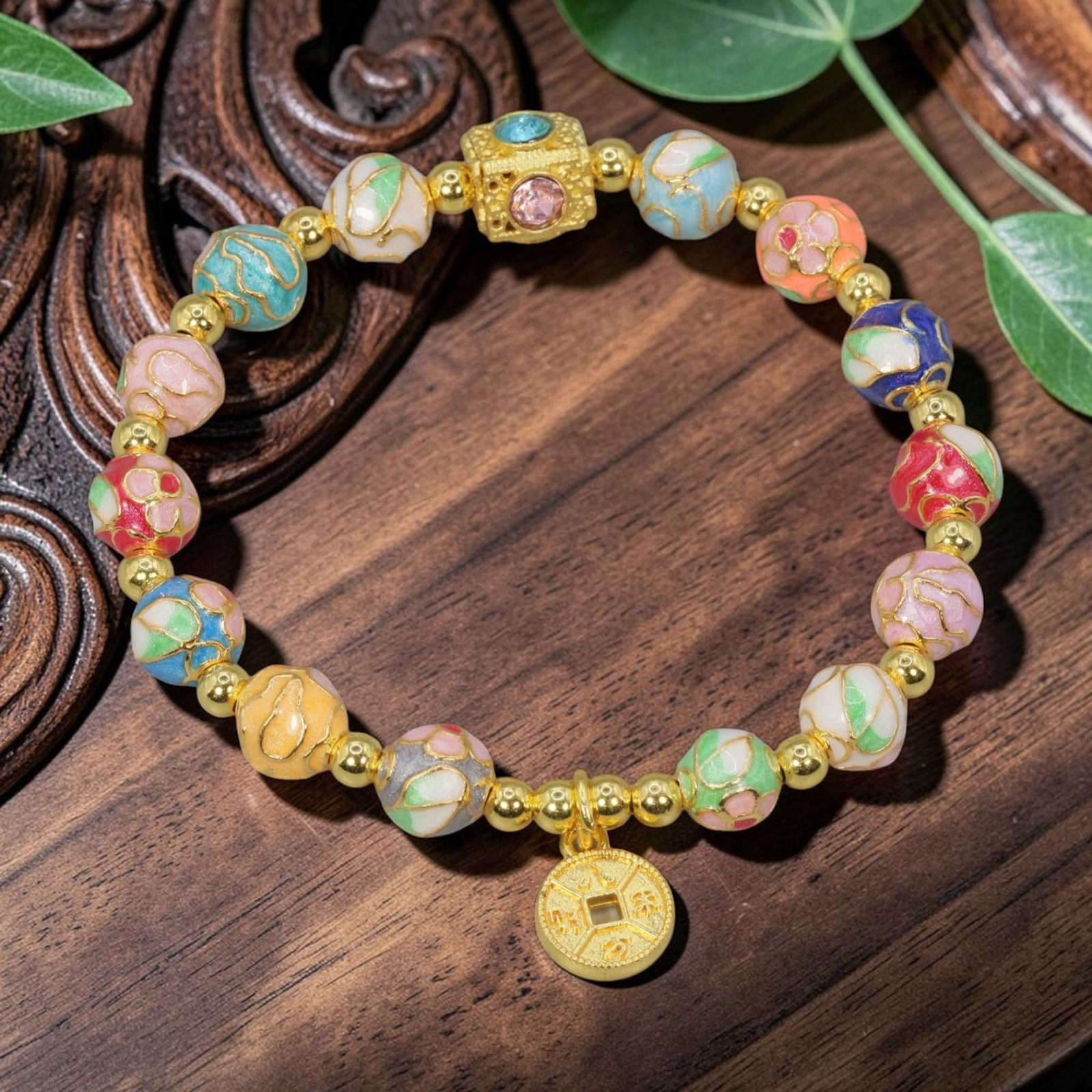 A Chinese Cloisonne Enamel Beaded Bracelet - Multicolor Gold Coin Charm, 46YJ: This modern Chinese-style bracelet features 9.67mm round cloisonne enamel beads in a vibrant mix of pastel hues, each detailed with raised gold-tone floral and cloud patterns. Small smooth gold-tone s