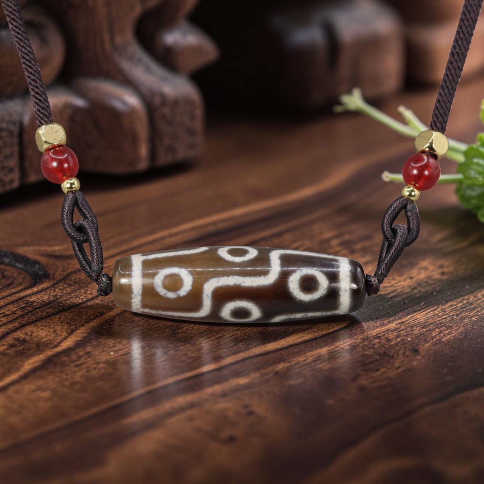 A Chinese Agate Nine Eye Dzi Bead - Tibetan Pendant Necklace, 13YJ: Crafted from warm brown polished natural agate with etched pale white mineral inlay forming intricate nine-eye symbolic motifs segmented by geometric connecting lines across the cylindrical bead form.
