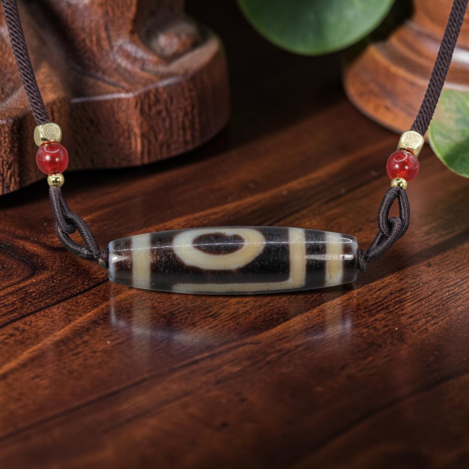 A Chinese Agate One Eye Dzi Bead - Tibetan Pendant Necklace, 4YJ: Crafted from polished natural agate with etched creamy white mineral inlay forming a single large enclosed one-eye symbolic motif bordered by thick horizontal banding across the cylindrical bead form.