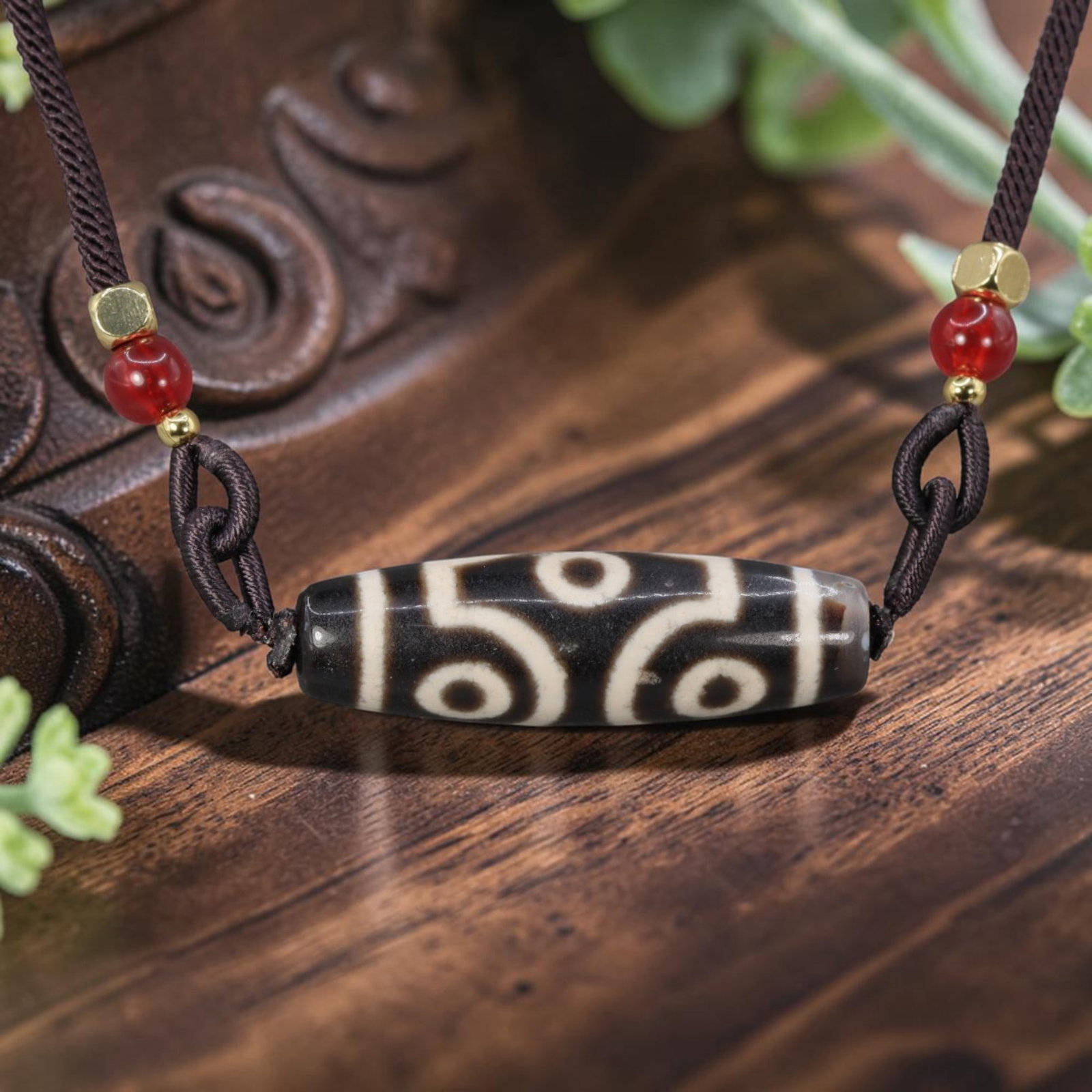 A Chinese Agate Six Eye Dzi Bead - Tibetan Pendant Necklace, 14YJ: Crafted from polished dark natural agate with etched pale white mineral inlay forming symmetrical six-eye symbolic motifs linked by curved geometric lines across the cylindrical bead form. The six eye
