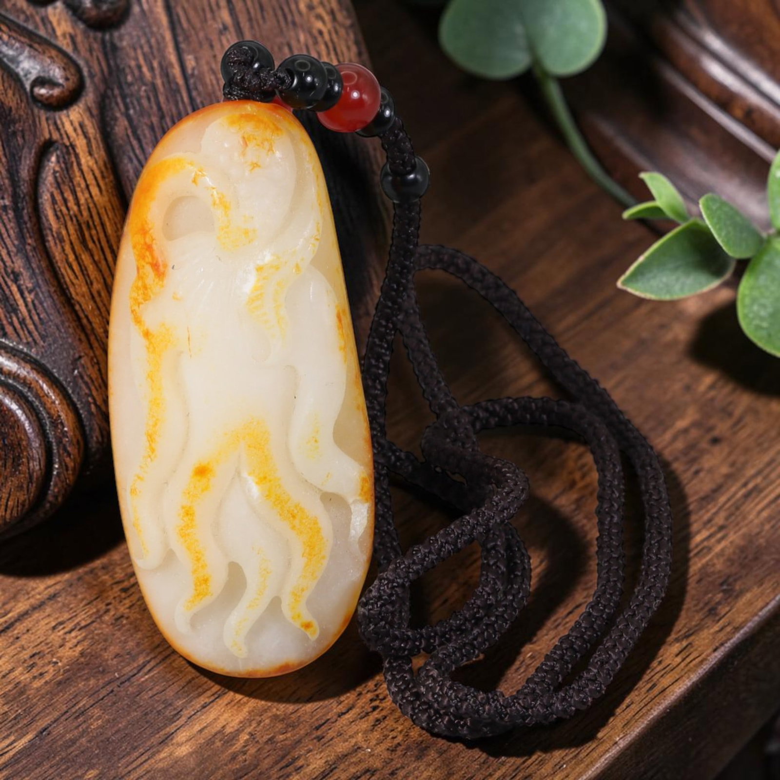 Natural Xinjiang Hetian White Nephrite Ginseng Carved Pendant With Natural Orange Russet Skin, 8AT: Hand-carved from genuine Xinjiang Hetian mutton fat white nephrite seed jade, this elongated oval pendant measures 7 x 3 cm, retaining its natural river-worn pebble shape with striking warm orange rus