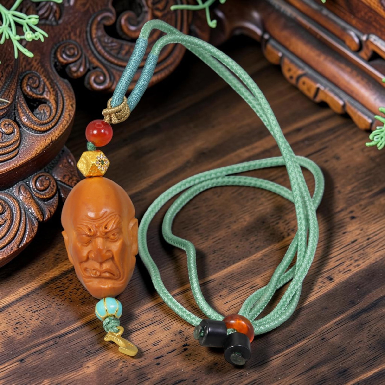 Chinese Olive Nut Pendant - Intense Fierce Arhat Luohan Head Carving, 17YJ: Carved from solid natural olive nut kernel, this wearable pendant features meticulous hand carving of an intense fierce-faced Arhat (Luohan) head with sharply defined furrowed brows and stern facial l
