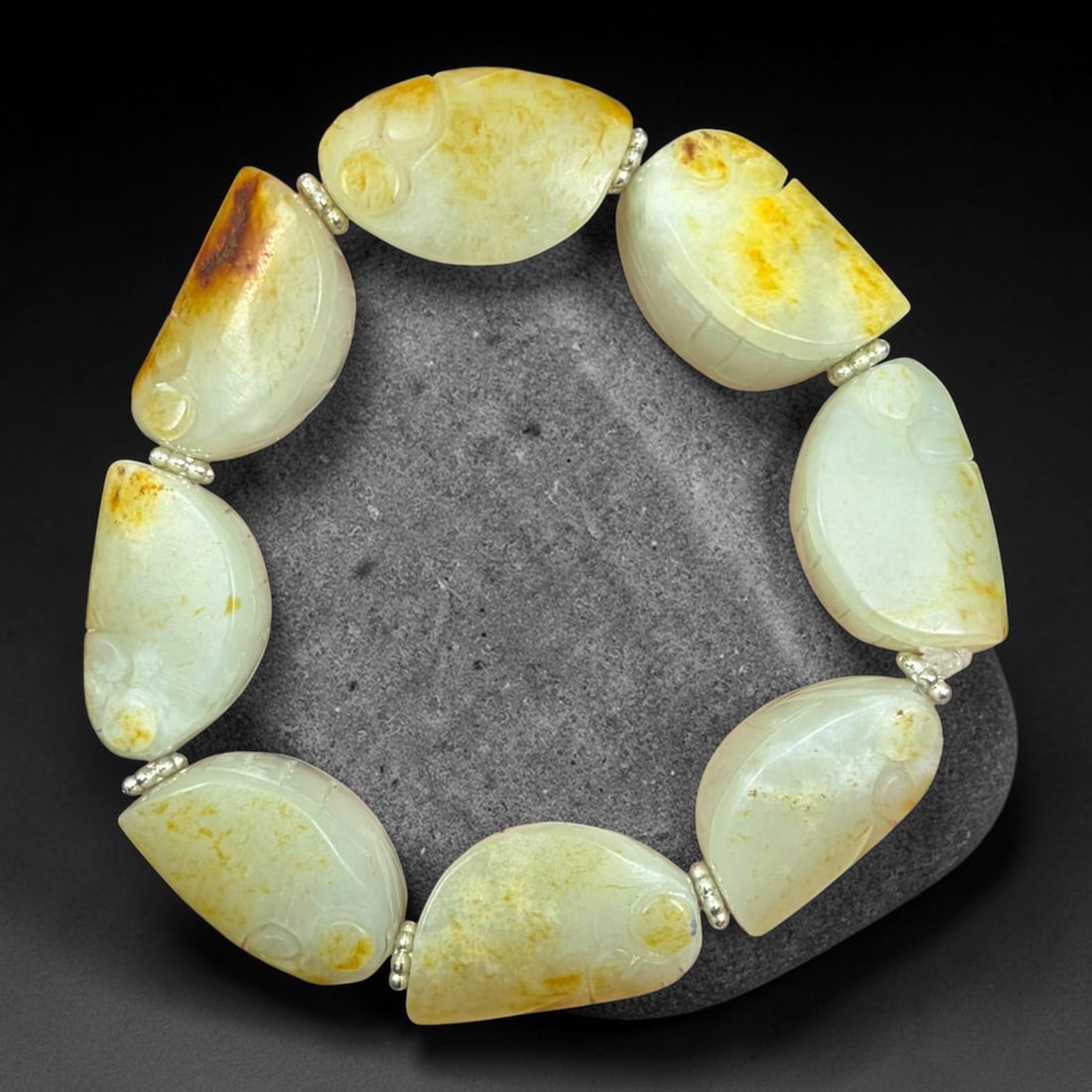 Natural Hetian Nephrite Jade Hand Carved Cicada Bracelet, Cicada Beads with Raw Yellow Skin, 25AS: Single strand handcrafted bracelet made of genuine Hetian nephrite jade, each focal bead finely carved into a lifelike cicada shape with dimensions 2.5cm x 1.5cm. The pale creamy white jade retains na