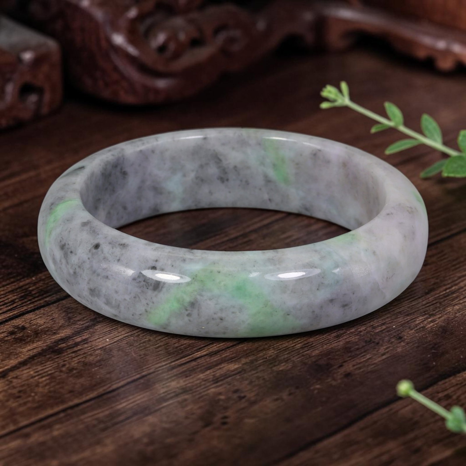 Natural Burmese Type A Green & Grey Jadeite Jade Bangle Bracelet, 67AZ: Crafted from natural Burmese Type A jadeite jade, this thick wide bangle features streaks of fresh green floating across a muted greyish-white base with scattered fine mineral speckles, forming a soft