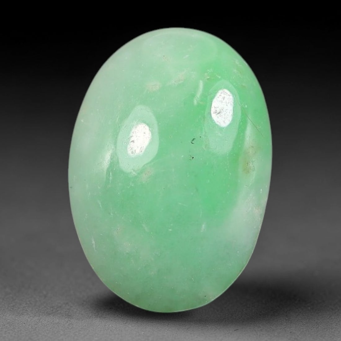 3.61ct Natural Burmese Type A Apple Green Jadeite Jade Cabochon, 88FA: This single loose natural Burmese Type A apple green jadeite jade cabochon, completely untreated, free of artificial dye, bleaching, or resin filling, preserving the original natural mineral crystal s