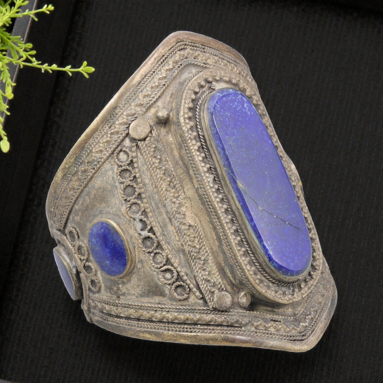 A Vintage Central Asian Silver-Plated Lapis Lazuli Cuff Bracelet, 33AH: A handcrafted vintage cuff bracelet, measuring approximately 6 cm in width, showcasing traditional Central Asian (Afghan/Turkmen) tribal jewelry design. The piece features a silver-plated metal base, 