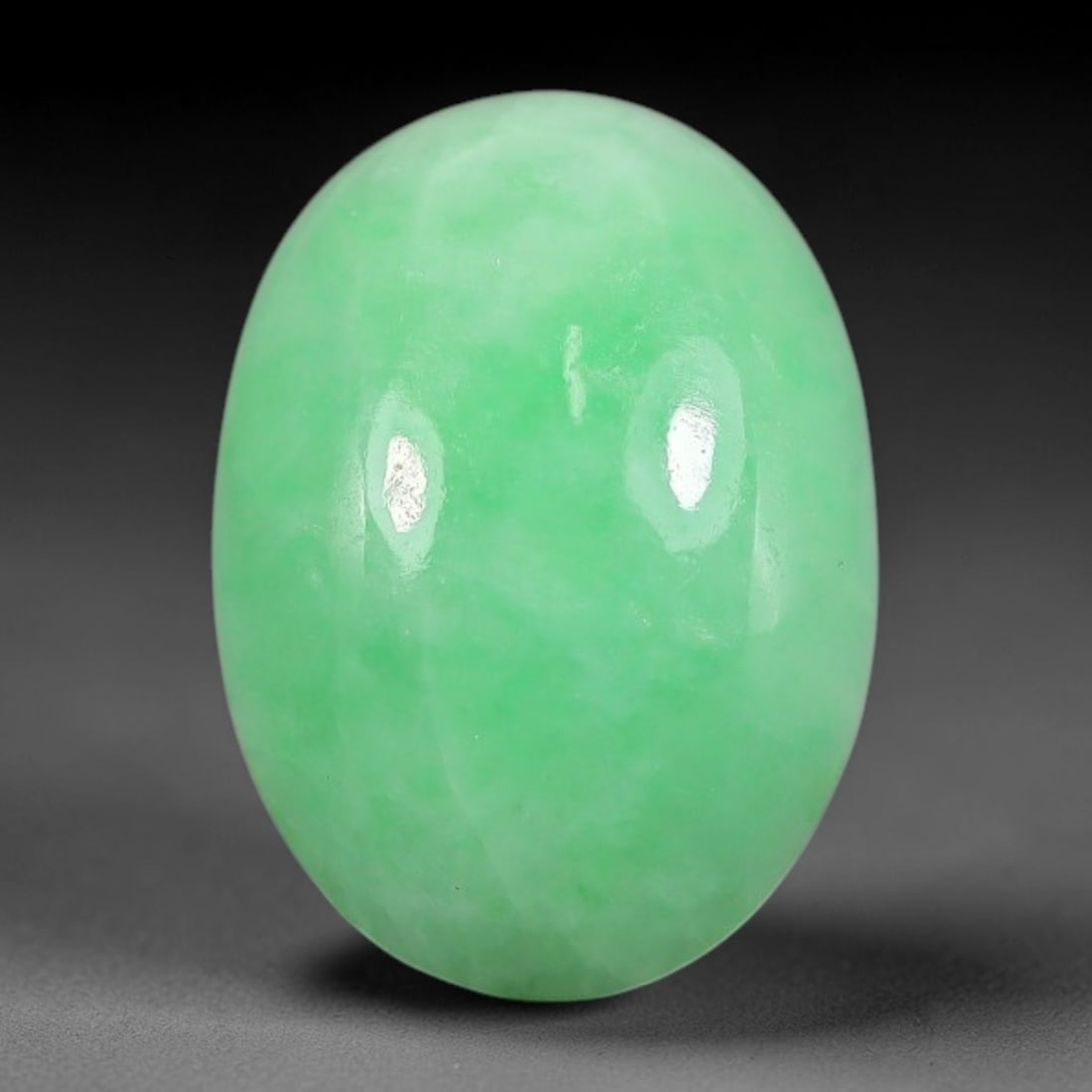 4.70ct Natural Burmese Type A Apple Green Jadeite Jade Cabochon, 76FA: This single loose natural Burmese Type A apple green jadeite jade cabochon, completely untreated, free of artificial dye, bleaching, or resin filling, preserving the original natural mineral crystal s