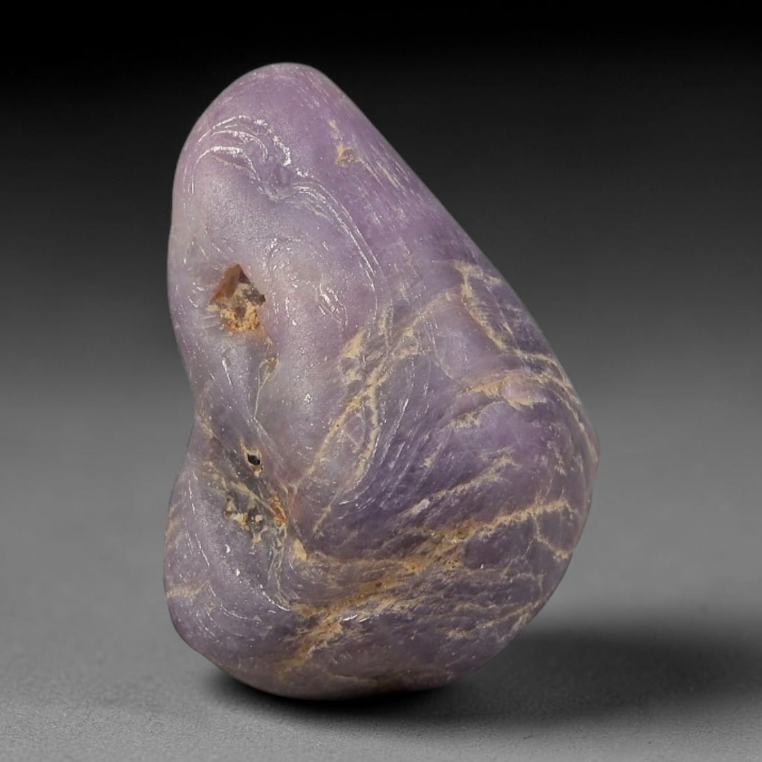 32.35ct Natural Unheated Sri Lankan Purplish Blue Sapphire Rough, 29FC: This natural corundum rough is an unheated purplish blue sapphire sourced from Sri Lankan alluvial gem deposits, featuring an irregular natural native form with residual pale yellow-brown mineral matr