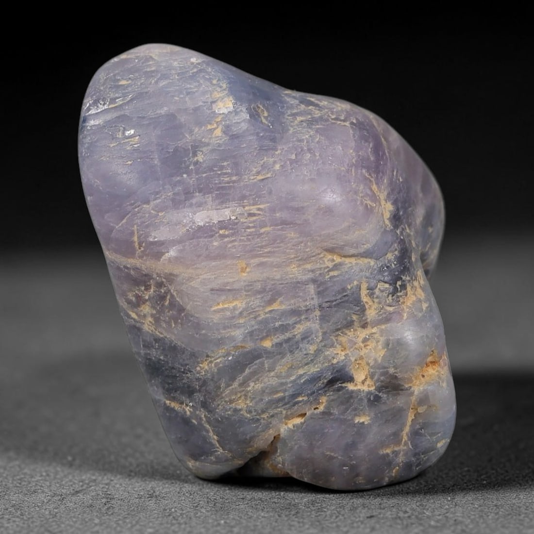 47.44ct Natural Unheated Sri Lankan Purplish Blue Sapphire Rough, 67FC: This natural corundum rough is an unheated purplish blue sapphire sourced from Sri Lankan alluvial gem deposits, featuring an irregular natural native form with residual pale yellow-brown mineral matr