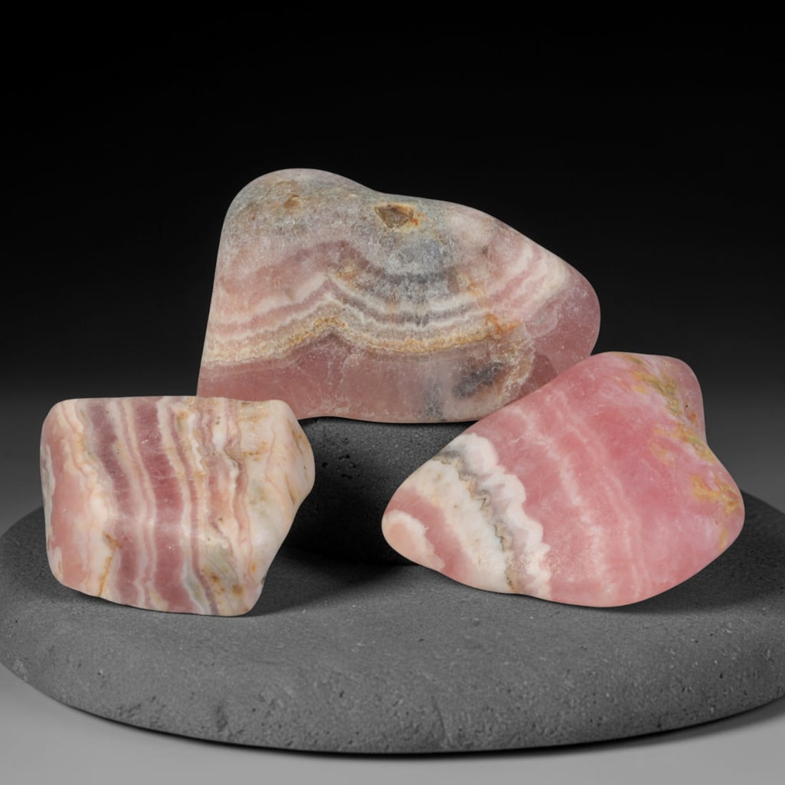 67ct 3pcs Natural Argentine Rhodochrosite Banded Tumbled Rough Set, 5FD: This listing features three individual tumbled rhodochrosite rough pieces sourced from Argentina Capillitas deposits, each showcasing distinct layered banding of soft rose pink, cream white and pale t