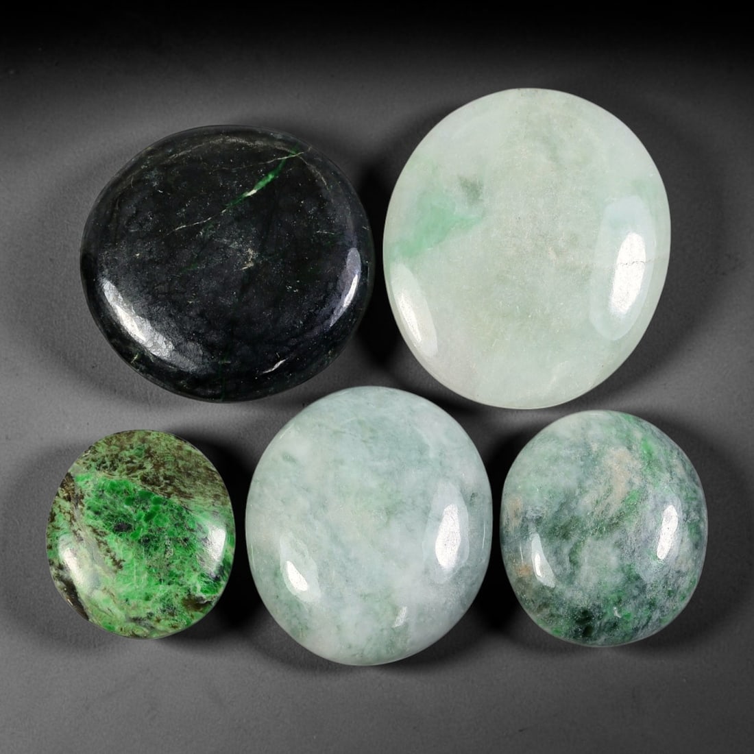 5pcs 128ct Natural Burmese Type A Dark Black Moss Speckled Ice Jadeite Jade Cabochons, 78AV: This wholesale bulk set contains 5 fully untreated natural Burmese Type A mixed round and oval jadeite jade cabochons with a total combined weight of 128ct, largest dimension 28x24mm. The lot features