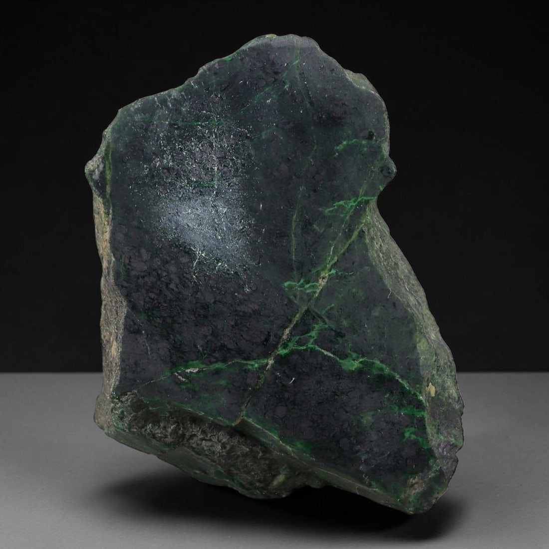 258ct Natural Type A Burmese Jadeite Jade Sliced Rough, 22AZ: This specimen is a sliced rough block of natural Type A Burmese jadeite jade. The interior displays natural colour zoning with visible mineral veining and crystalline patterns typical of unprocessed j