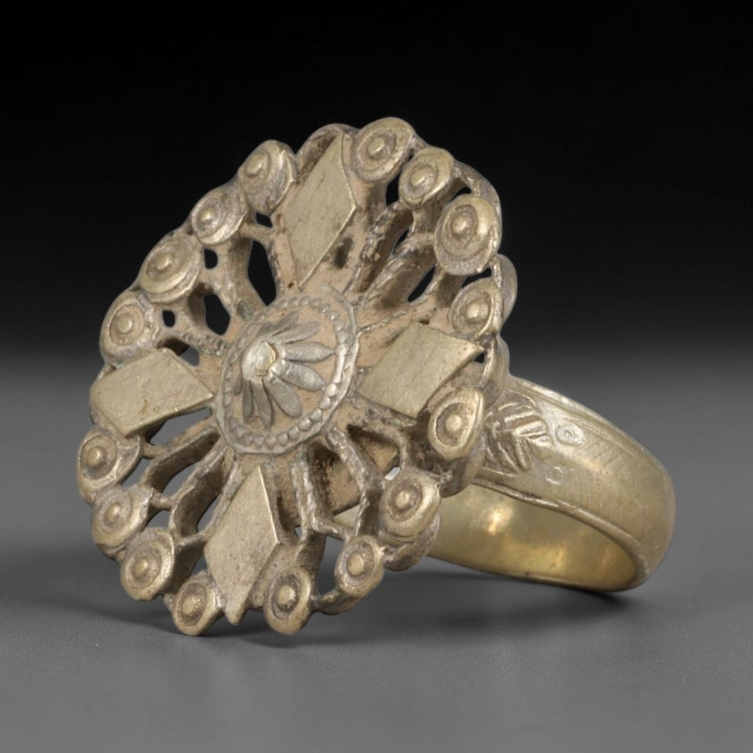 Antique Central Asian Silvered Metal Openwork Floral Sunburst Statement Ring, 69AA: Vintage antique tribal finger ring handcrafted from silvered base metal, with a symmetrical circular ring face measuring 2.5cm x 2.5cm. The elaborate openwork face features a central rosette flower mo