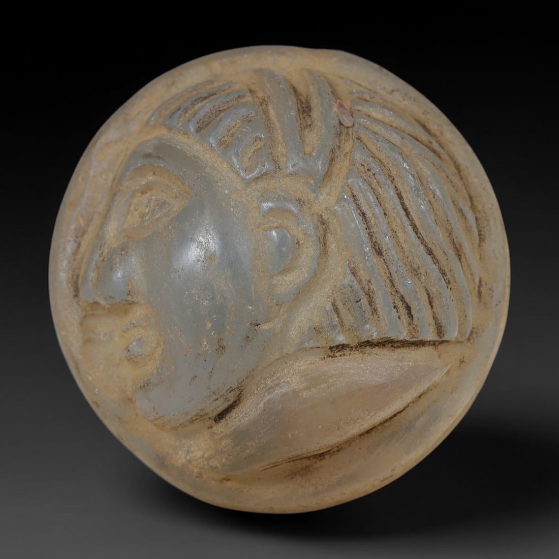 Ancient Medieval Egyptian Hand Carved Glass Intaglio Bead Talisman, 86AP: Antique wearable ornament expertly worked from translucent ancient glass material, originating from Medieval Egyptian Nile Valley craft traditions. Glass was a prized artistic medium across Egyptian a