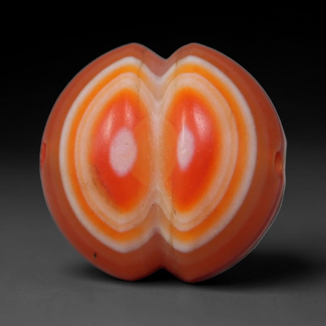 Vintage Tibetan Natural Carnelian Agate Bead Talisman, 99AP: Small traditional wearable bead hand polished from solid natural carnelian agate mineral, originating from Himalayan Tibetan cultural craft heritage. Carnelian agate was a widely cherished stone mater