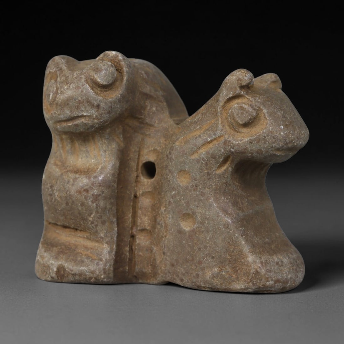 Ancient Near Eastern Hand Carved Stone Protective Amulet, 85AP: Small antique wearable talisman meticulously hewn from natural sedimentary stone, measuring 2.5cm x 2cm, originating from the Ancient Near Eastern cultural sphere. Stone miniature talismans were core 