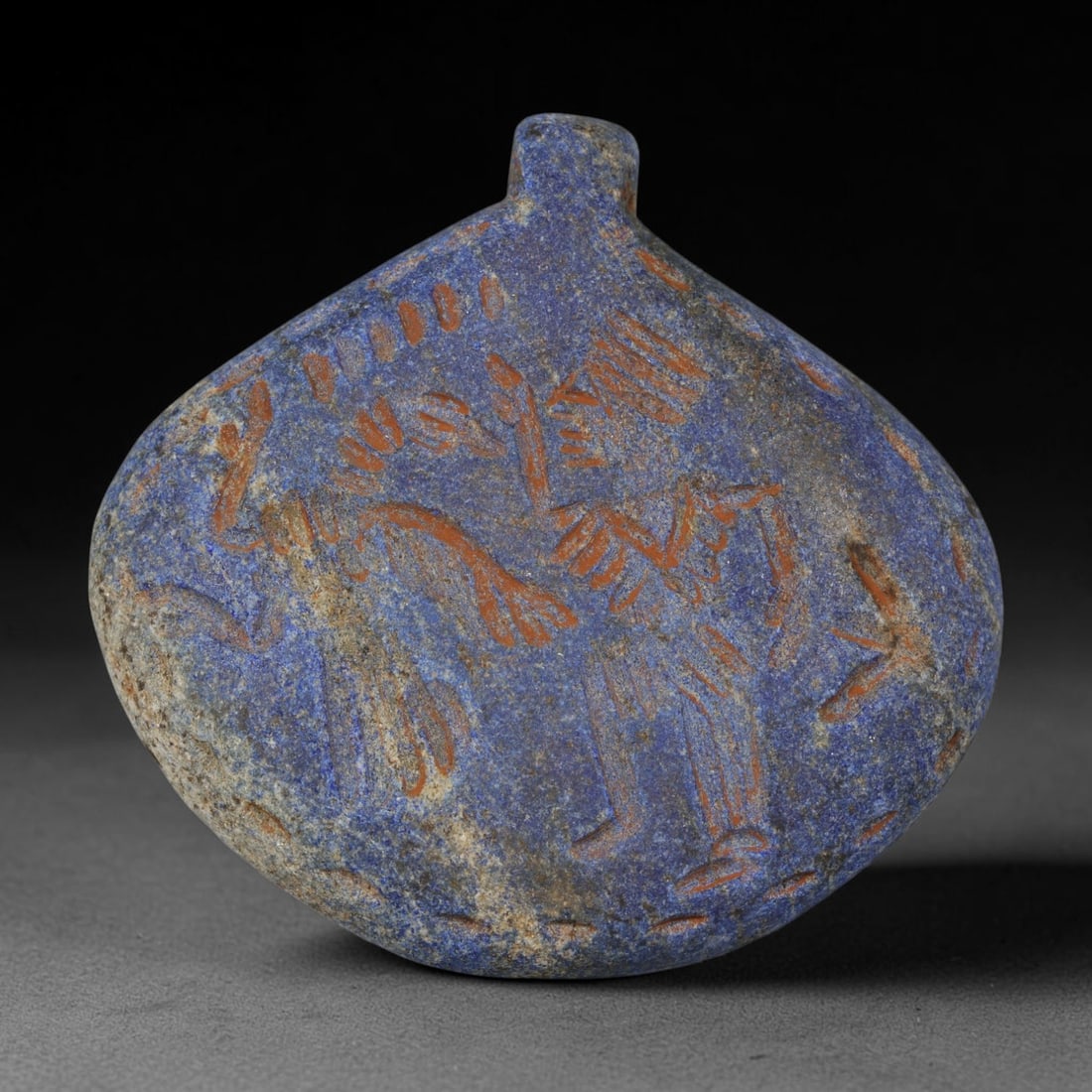 Ancient Sasanian Lapis Lazuli Hand Carved Amulet, 38AP: Antique wearable protective amulet fully carved from solid natural lapis lazuli stone, originating from the historic Sasanian Empire cultural sphere. Lapis lazuli was an immensely valued sacred stone 