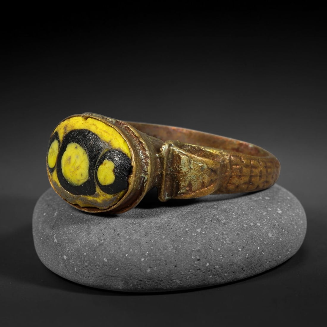 Antique Qajar Dynasty Copper Alloy Ring Set With Banded Glass Bead Cabochon, 56AC: Historic wearable signet ring crafted from textured copper alloy metal, sized to US ring size 9, originating from Qajar Persian artistic and adornment traditions of late medieval Iran. Copper alloy wa