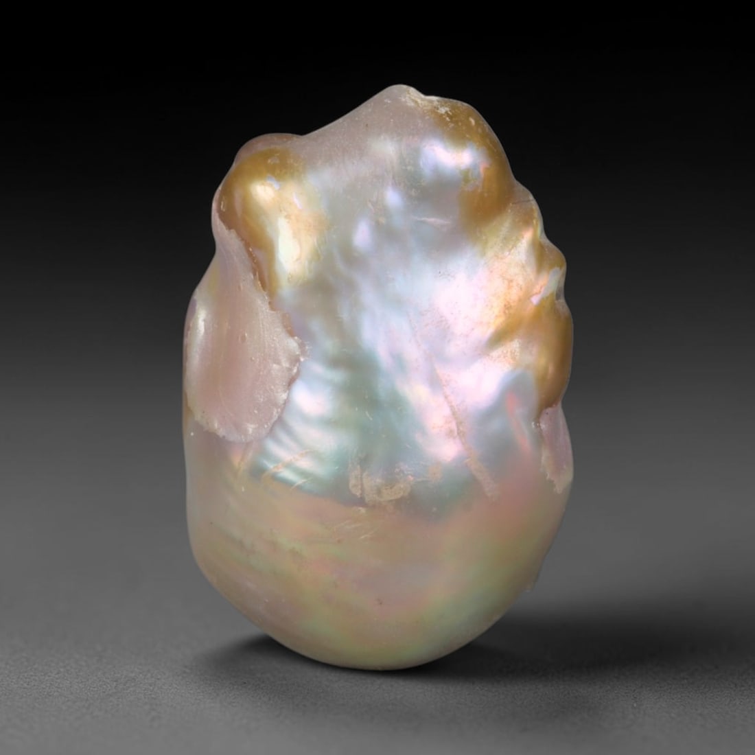 Natural Freshwater Keshi Pearl - Iridescent Baroque Pearl Ornament, 66AE: A natural freshwater keshi pearl with organic asymmetrical baroque shaping, exhibiting soft creamy blush base tones with shifting pastel pink, lavender and pale gold iridescent luster across its smoot