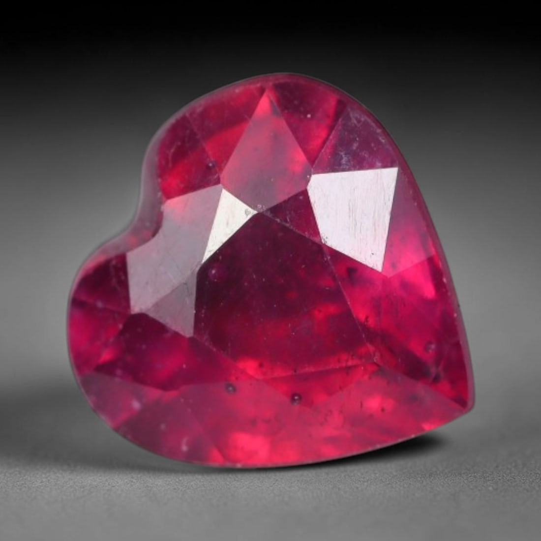 1.67 Carats Natural Madagascar Vivid Fuchsia Red Heated Ruby Loose Gemstone, 80AG: This vivid fuchsia red Madagascar ruby displays rich saturated red tone with subtle natural internal mineral traces that showcase genuine earth-grown character, measured at 7.1x4.2mm, the intense warm