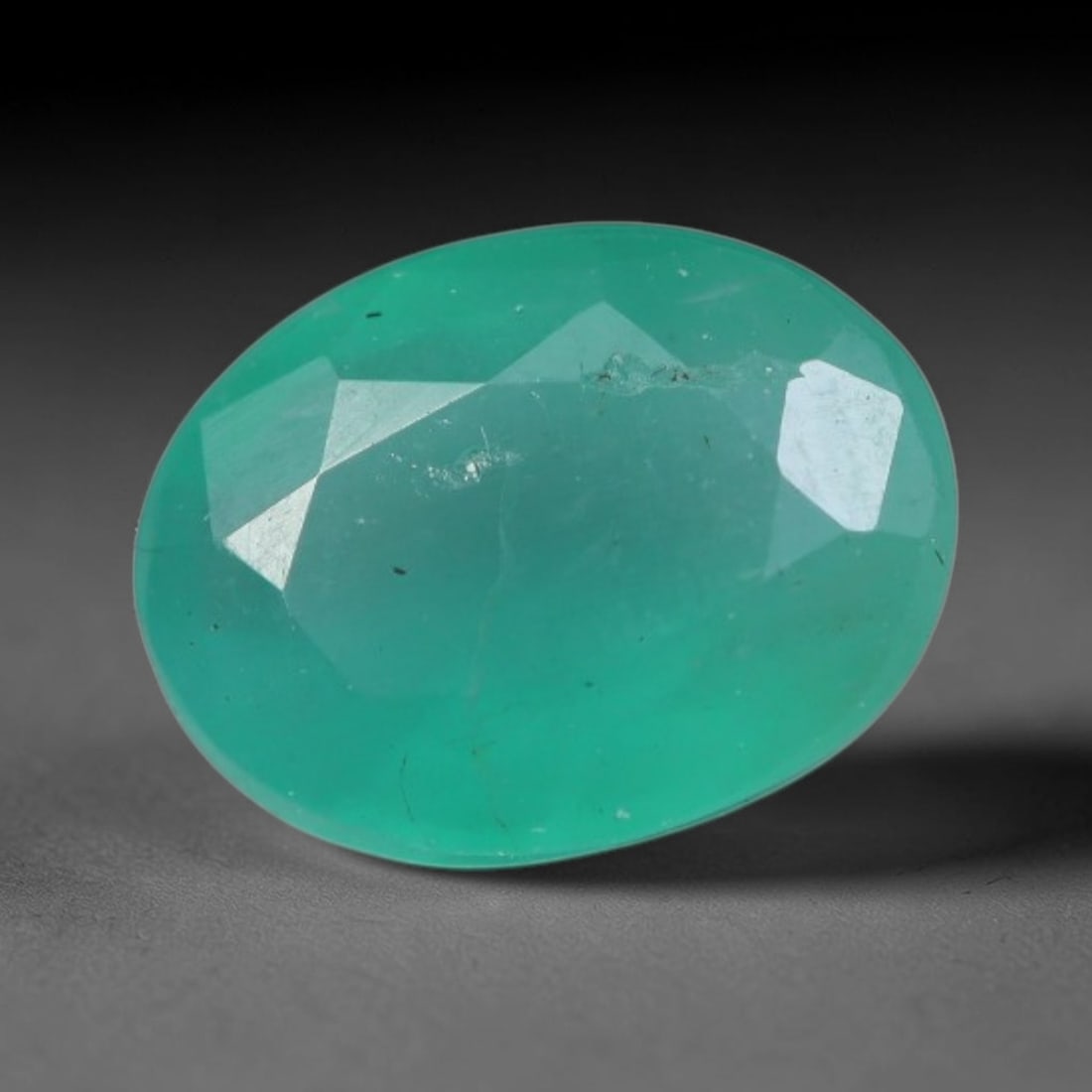 1.09 Carats Natural Zambian Green Emerald Loose Gemstone, 90AG: This green Zambian emerald holds smooth even saturation with subtle faint natural internal markings lending authentic organic character, measured at 7.7x5.9x3.6mm, its calm cool green tone delivers un