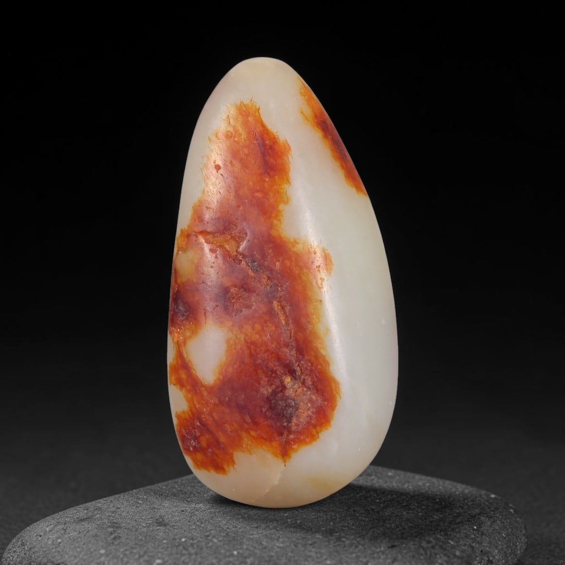 Natural Chinese Xinjiang Hetian Pebble Nephrite Jade Drilled Pendant Stone, 78AC: All-natural river-worn nephrite jade pebble sourced from Xinjiang regional river deposits, measuring 47x23x13mm with a total weight of 123 carats, prepared as a ready-to-string pendant piece with a pr