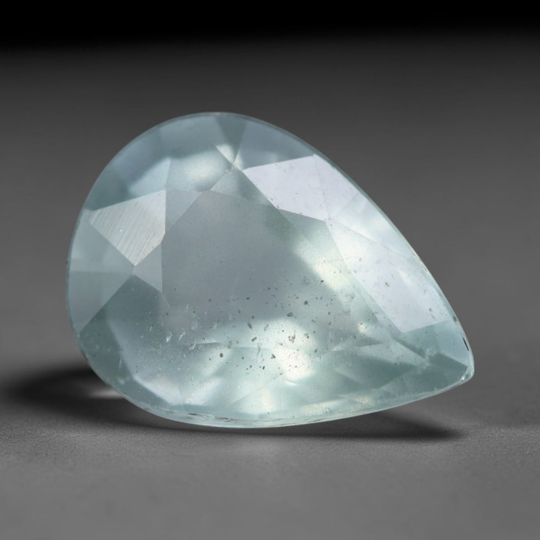 2.91 Carats Natural Brazilian Soft Sky Blue Aquamarine Loose Gemstone, 36AG: This serene sky blue aquamarine carries smooth icy pale blue saturation with gentle light refracting across its polished facets, measured at 11.7x8.6x5.3mm, its cool tranquil tone lends effortless ele