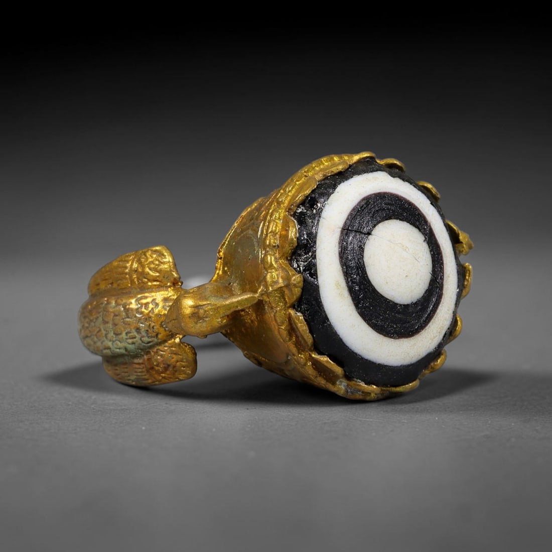 Antique Qajar Dynasty Copper Alloy Ring Set With Banded Glass Bead Cabochon, 59AC: Historic wearable signet ring crafted from textured copper alloy metal, sized to US ring size 8.5, originating from Qajar Persian artistic and adornment traditions of late medieval Iran. Copper alloy 