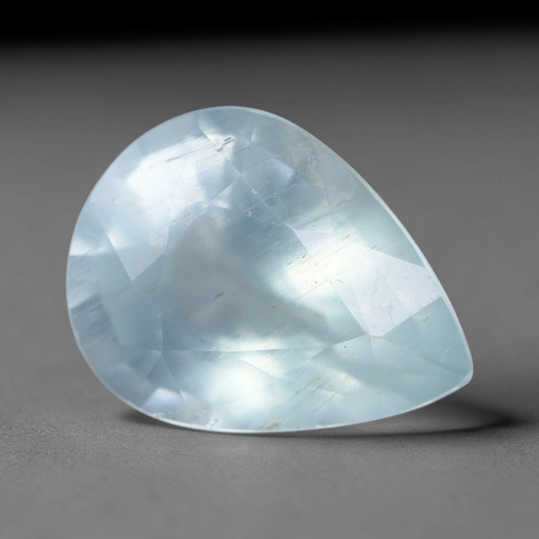 2.15 Carats Natural Brazilian Soft Sky Blue Aquamarine Loose Gemstone, 39AG: This serene sky blue aquamarine carries smooth icy pale blue saturation with gentle light refracting across its polished facets, measured at 10.3x8x5.3mm, its cool tranquil tone lends effortless elega
