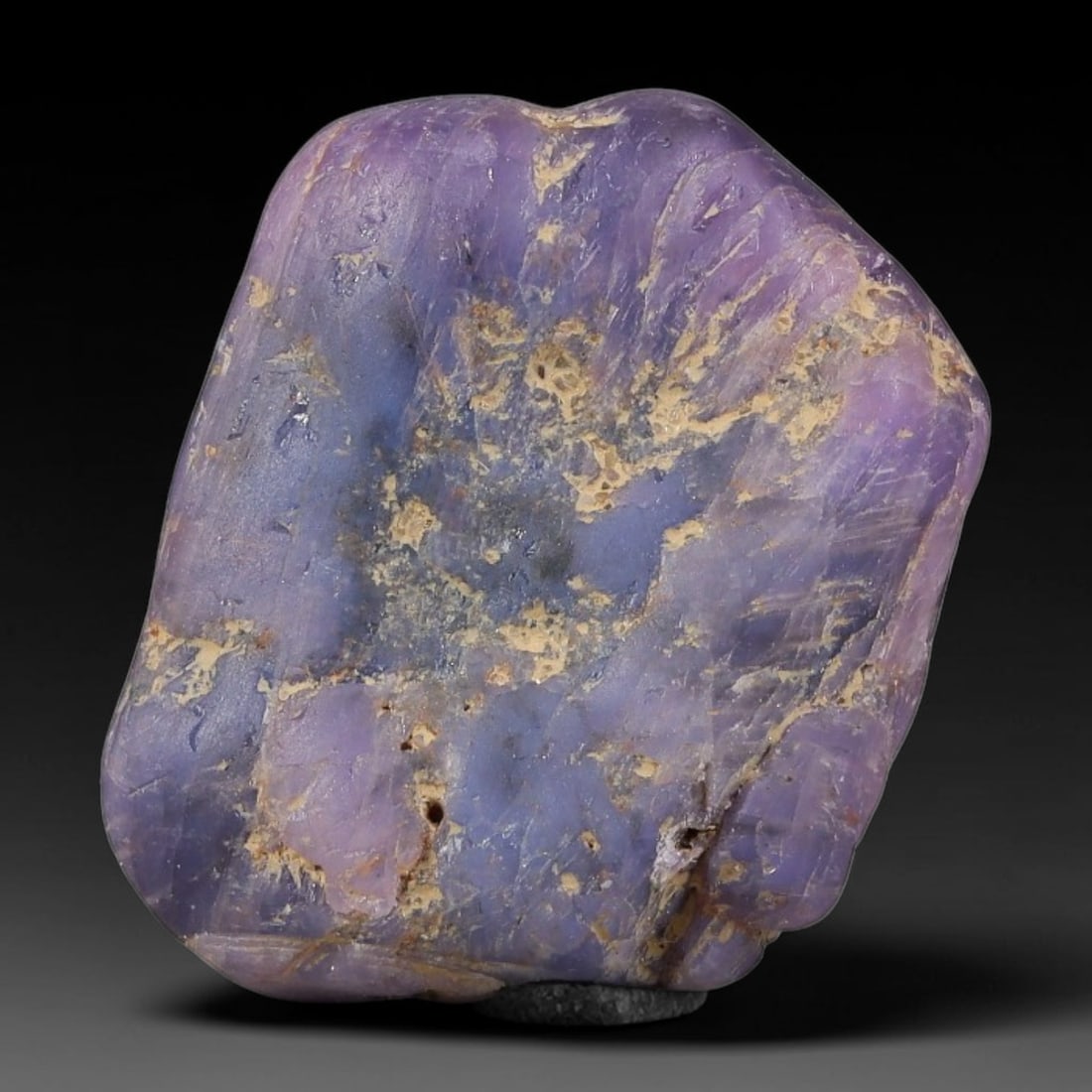 37.97ct Natural Unheated Sri Lankan Purplish Blue Sapphire Rough, 47FC: This natural corundum rough is an unheated purplish blue sapphire sourced from Sri Lankan alluvial gem deposits, featuring an irregular natural native form with residual pale yellow-brown mineral matr