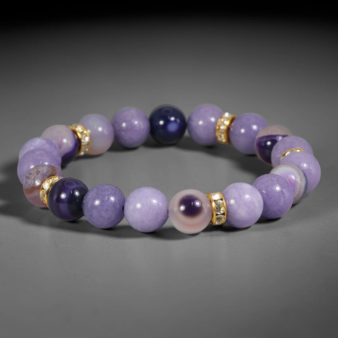 Natural Purple Banded Agate Round Bead Bracelet with Crystal Gold Tone Spacers, 79AE: Hand-strung bracelet constructed from polished 10mm spherical natural agate beads, featuring a harmonious palette of soft lavender matte agate paired with striking banded eye agate showcasing concentr