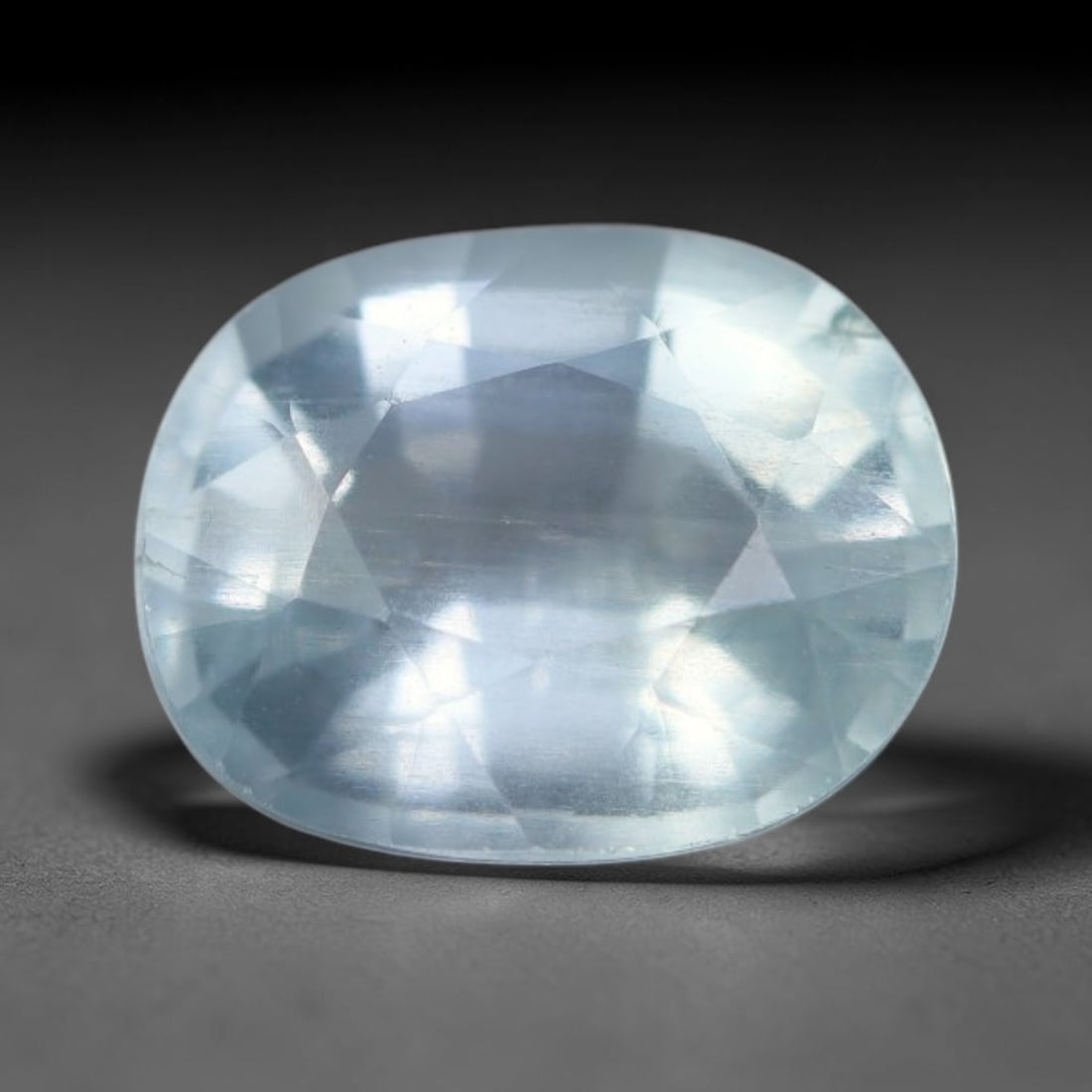 1.67 Carats Natural Brazilian Soft Sky Blue Aquamarine Loose Gemstone, 40AG: This serene sky blue aquamarine carries smooth icy pale blue saturation with gentle light refracting across its polished facets, measured at 8.4x6.7x4.7mm, its cool tranquil tone lends effortless eleg