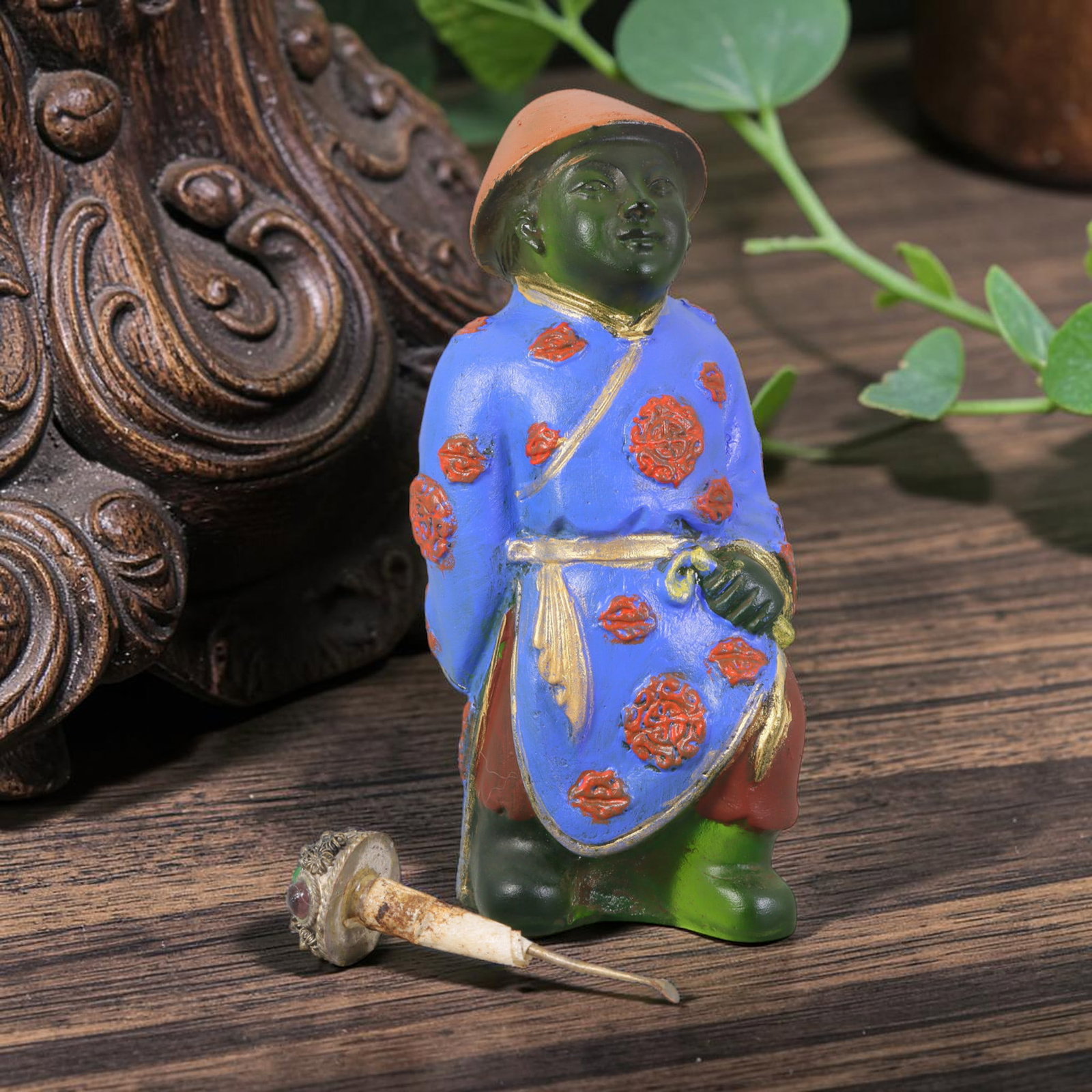 Vintage Chinese Liuli Glass Snuff Bottle - Standing Robed Attendant, 45AS: This snuff bottle is moulded from translucent green liuli glass, formed as a standing attendant figure wearing a rounded cap. The bright blue robe is decorated with hand-painted red floral medallions 
