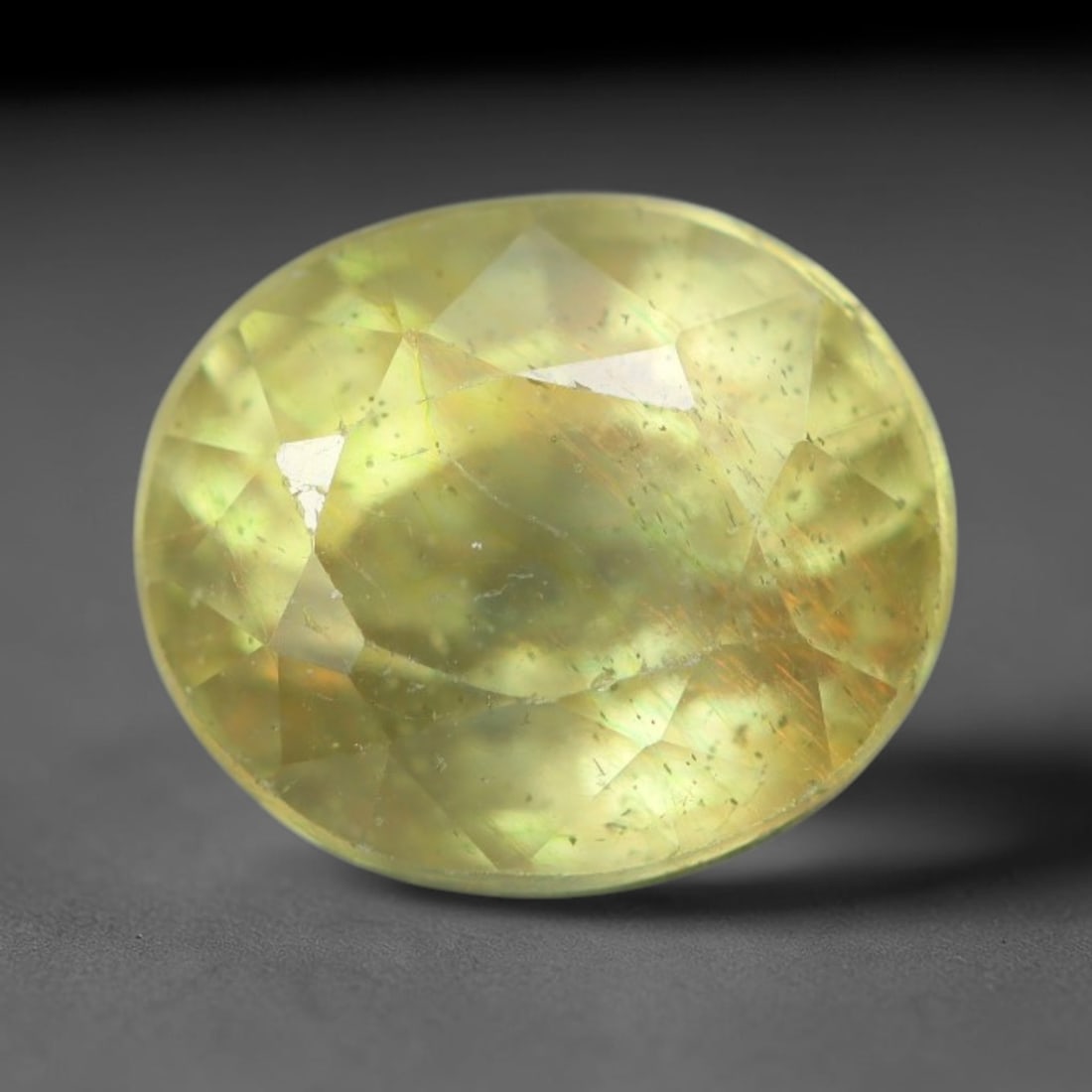 2.08 Carats Natural African Bright Lemon Yellow Sapphire Loose Gemstone, 23AG: This vivid lemon yellow sapphire radiates warm saturated golden hue with crisp faceted light dispersion, measured at 7.2x6.2x5mm, fine natural internal needle inclusions add authentic organic characte
