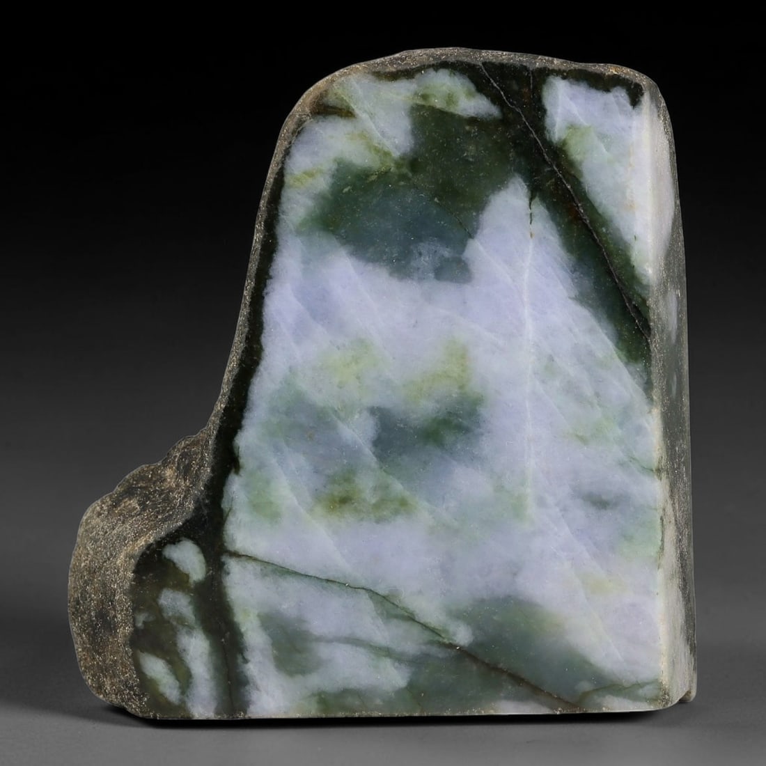 745ct Natural Type A Burmese Two-Sided Landscape White Cloud Green Jadeite Jade Sliced Rough, 7FA: This uniquely contoured irregular slab is untreated Type A natural Burmese jadeite, retaining rugged dark weathered host rock skin along its outer perimeter edge. Both front and back polished faces sh