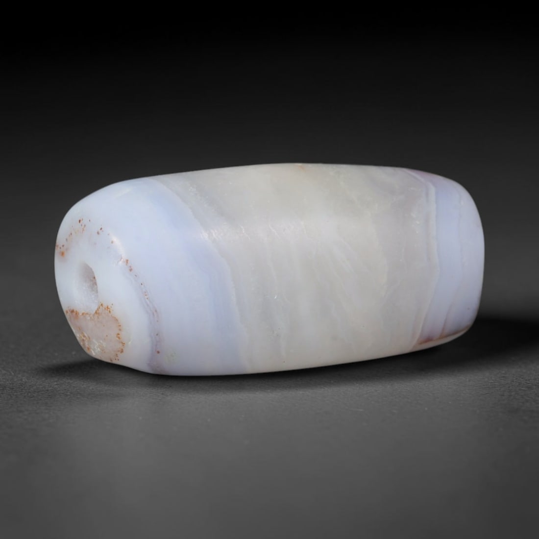 Ancient Ming Dynasty Pale Lavender Wavy Banded Agate Barrel Bead (1368-1644 CE), 87AD: This delicate pale banded agate barrel bead originates from China's Ming Dynasty, a celebrated era of traditional Chinese lapidary arts where agate ornaments were favored for literati and noble daily 