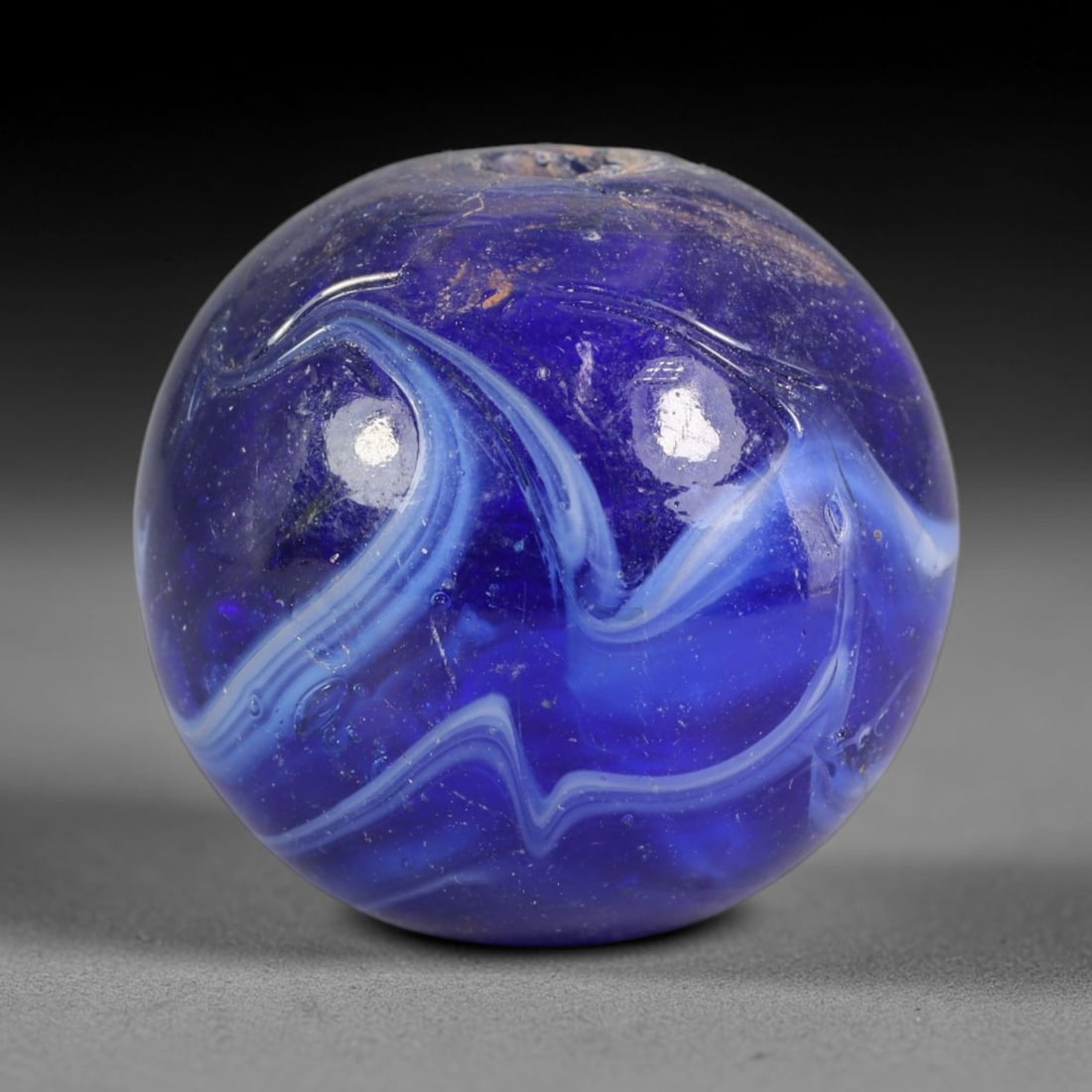 Swirled Blue Blown Glass Bead - Handmade Vintage Spherical Ornament, 13AE: Hand-blown glass construction forms this perfectly spherical bead, featuring layered swirling bands of deep cobalt blue, pale sky blue and opaque white glass that flow in continuous marbled striations