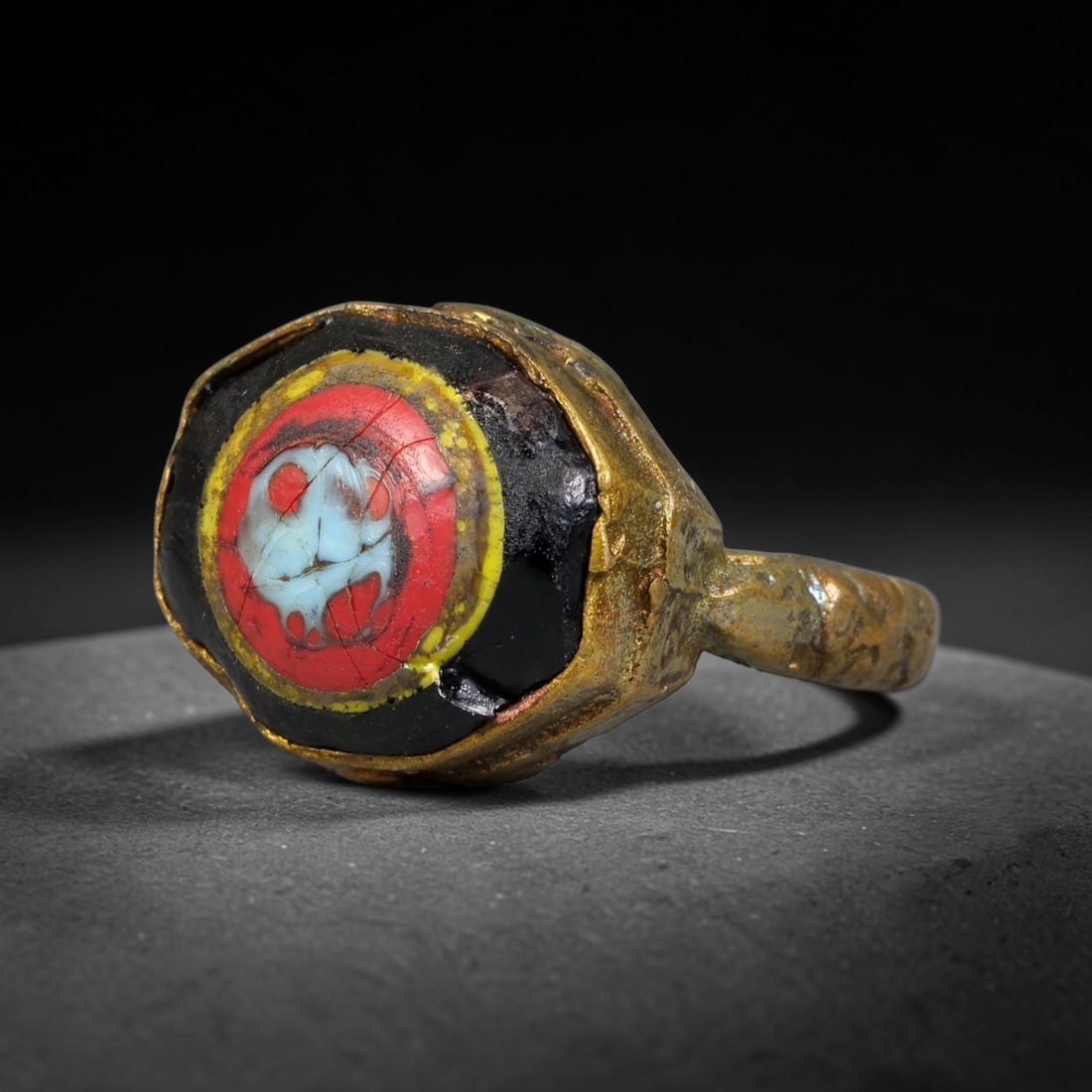Antique Qajar Dynasty Copper Alloy Ring Set With Banded Glass Bead Cabochon, 54AC: Historic wearable signet ring crafted from textured copper alloy metal, sized to US ring size 9.50, originating from Qajar Persian artistic and adornment traditions of late medieval Iran. Copper alloy