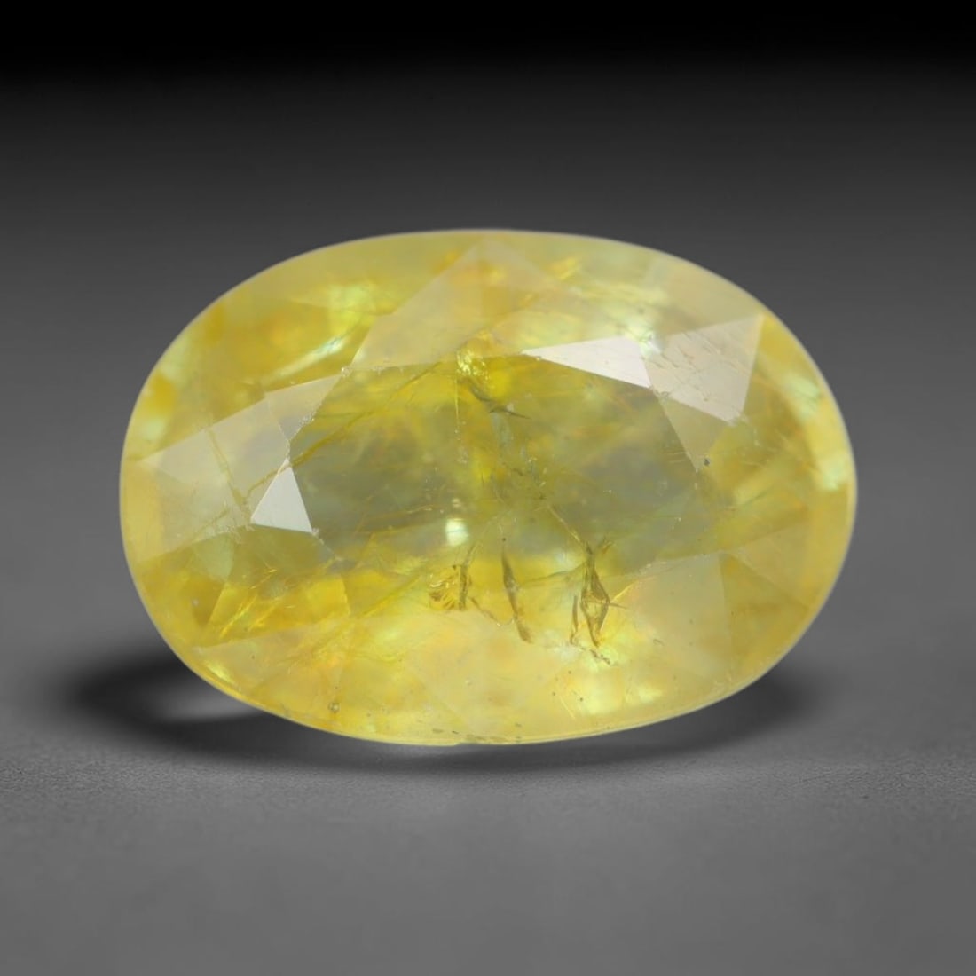 2.34 Carats Natural African Bright Lemon Yellow Sapphire Loose Gemstone, 21AG: This vivid lemon yellow sapphire radiates warm saturated golden hue with crisp faceted light dispersion, measured at 9.2x6.6x4.2mm, fine natural internal needle inclusions add authentic organic charac