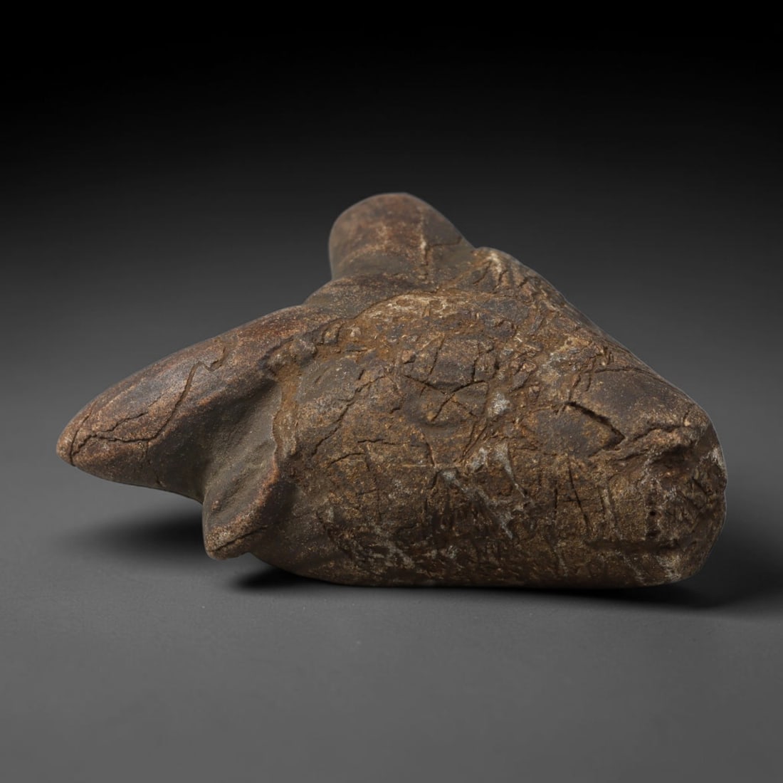 Ancient Medieval Near Eastern Tribal Hand Carved Stone Effigy Amulet, 16AC: Medium antique portable sacred effigy hand hewn from natural sedimentary stone, originating from Medieval Near Eastern tribal craft and spiritual traditions. Solid stone effigies were staple devotiona