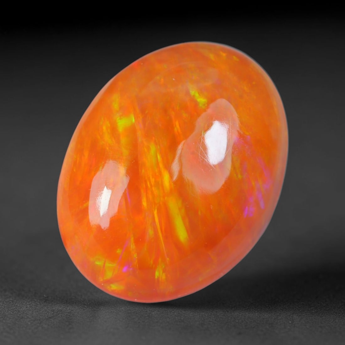 3.37 Carats Natural Ethiopian Welo Tangerine Orange Opal Cabochon Loose Gemstone, 46AG: This glossy polished opal boasts a rich glowing tangerine orange base interlaced with streaks of vivid lime yellow, electric green and faint magenta shifting play of color, measured at 13.5x10.4x5mm, 