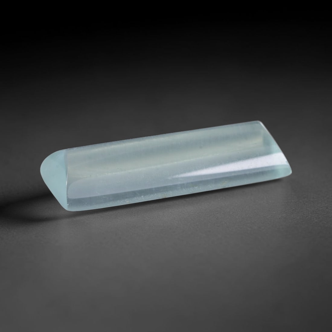 4.20 Carats Natural Brazilian Sky Blue Sugarloaf Aquamarine Loose Gemstone, 70AG: This smooth sugarloaf aquamarine features soft milky sky blue coloring with fine natural fibrous internal inclusions that lend gentle diffused luster across its polished surface, measured at 17.3x7.4x