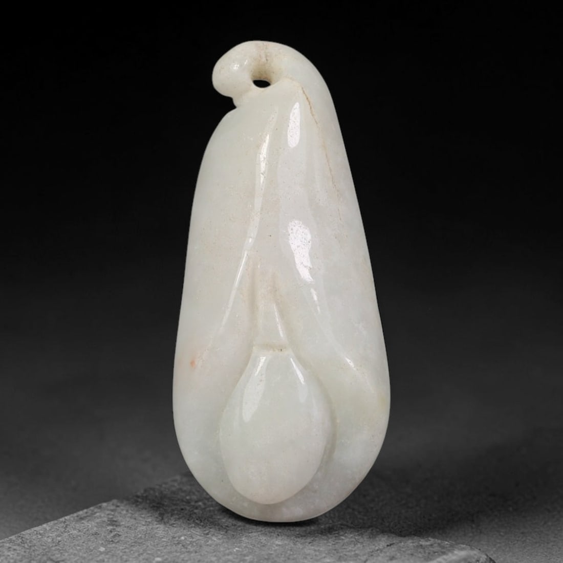 Natural Vintage Burmese Type A Jadeite Jade Magnolia Flower Bud Pendant, 63AA: Hand-carved vintage wearable pendant crafted from untreated natural Burmese Type A jadeite jade, measuring 3cm x 1.4cm. The piece is sculpted into a smooth elongated magnolia flower bud form with soft