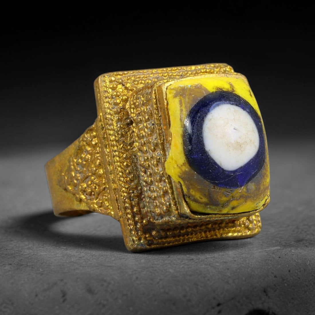 Antique Qajar Dynasty Copper Alloy Ring Set With Banded Glass Bead Cabochon, 68AC: Historic wearable signet ring crafted from textured copper alloy metal, sized to US ring size 8.5, originating from Qajar Persian artistic and adornment traditions of late medieval Iran. Copper alloy 