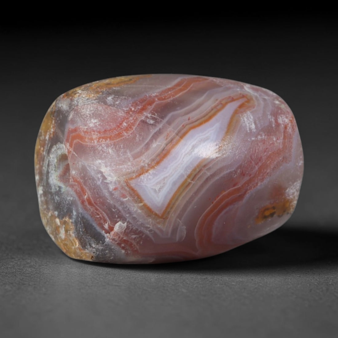 Ancient Assyrian Civilization Banded Agate Barrel Bead (2500-609 BCE), 33AD: This antique banded agate barrel bead originates from the Assyrian Civilization, a major Northern Mesopotamian power that operated large-scale agate carving workshops to produce ornate beads for palac