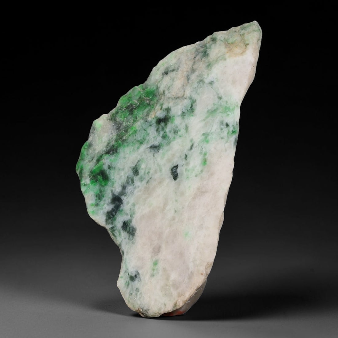270ct Natural Type A Burmese Jadeite Jade Sliced Rough, 99AZ: This specimen is a sliced rough block of natural Type A Burmese jadeite jade. The interior displays natural colour zoning with visible mineral veining and crystalline patterns typical of unprocessed j