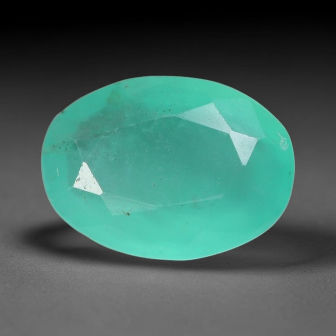 0.92 Carats Natural Zambian Green Emerald Loose Gemstone, 89AG: This green Zambian emerald holds smooth even saturation with subtle faint natural internal markings lending authentic organic character, measured at 8.1x5.9x3.1mm, its calm cool green tone delivers un